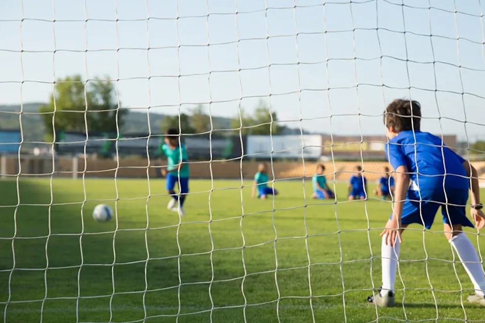 A young goalkeeper on the pitch